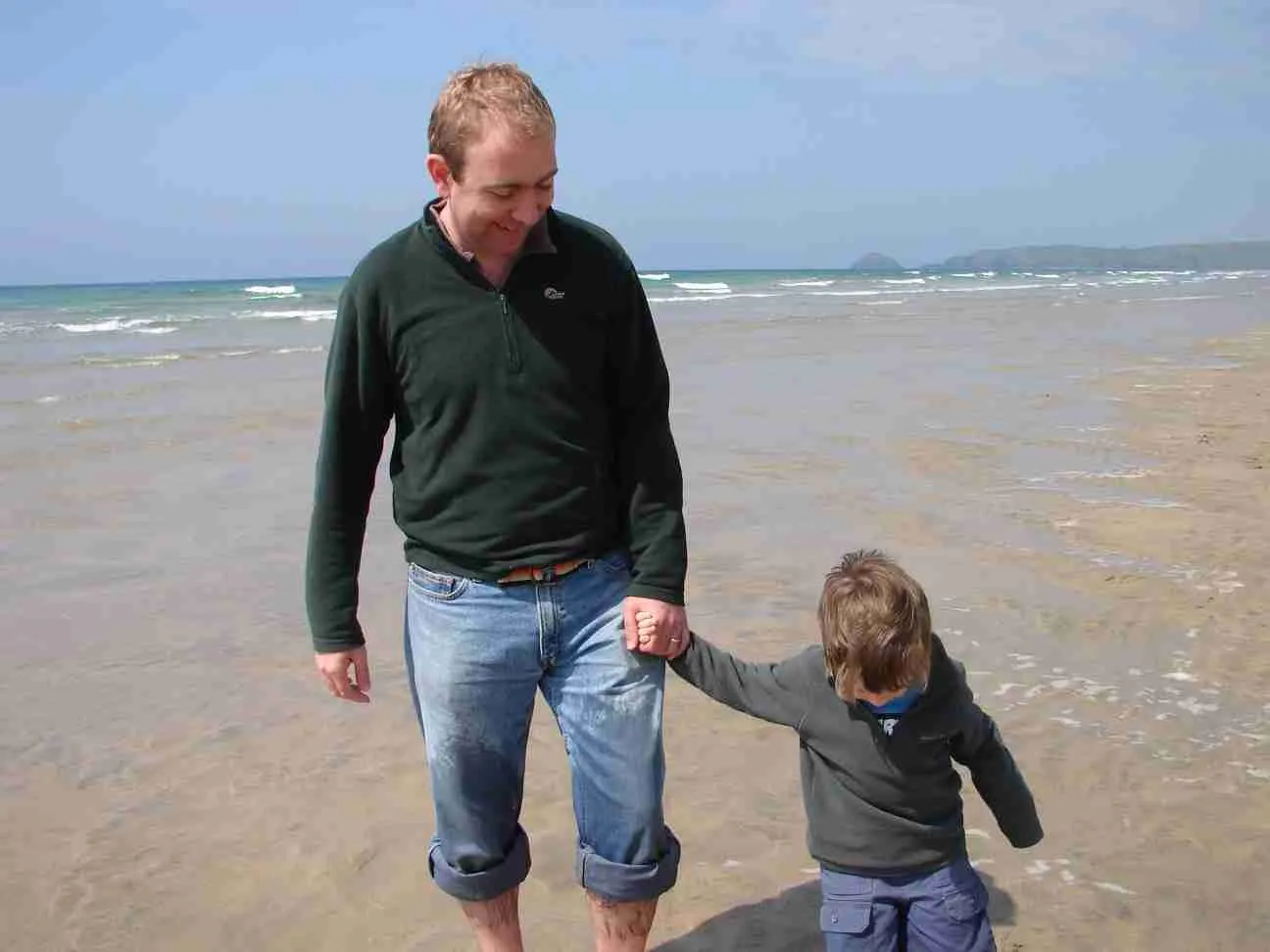 nick and harry walking on beach